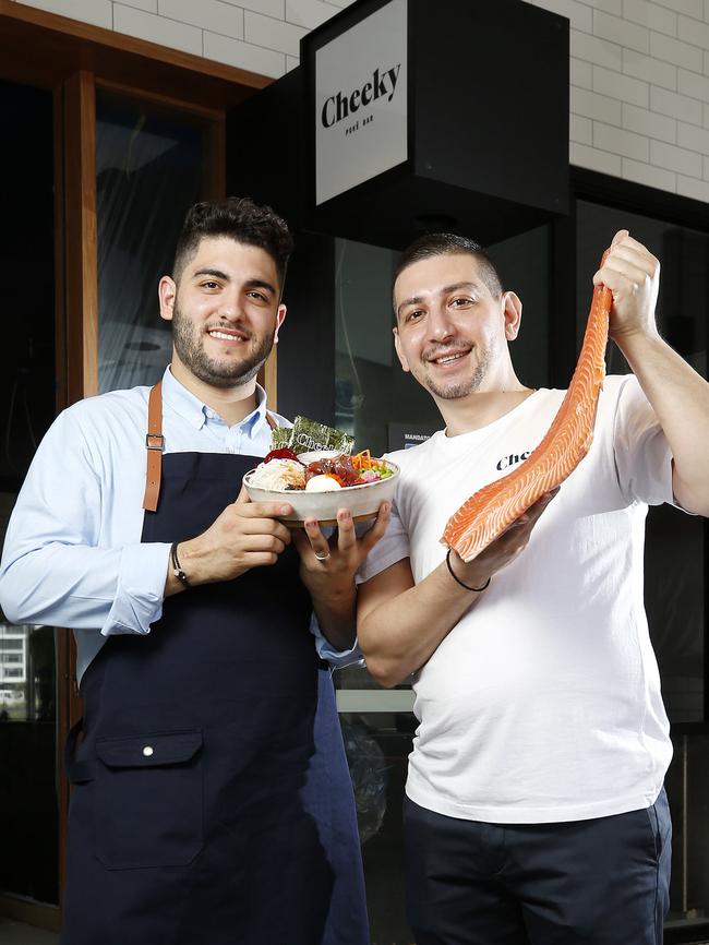 Sam Demetriou and Greg Kalligeros outside their new restaurant in Newstead, Cheeky Poke Bar. Picture: AAP Image/Josh Woning