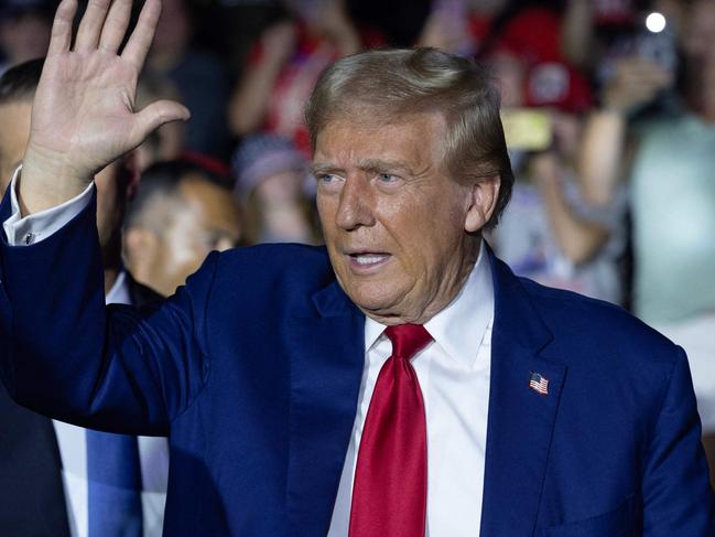 FLINT, MICHIGAN - SEPTEMBER 17: Republican presidential nominee, former U.S. President Donald Trump arrives for a campaign event, his first since a man carrying a rifle was arrested Sunday near where Trump was playing golf at his club in Florida, in the Dort Financial Center on September 17, 2024 in Flint, Michigan. Trump was playing an unscheduled game with real estate developer Steve Witkoff at the Trump International Golf Club in West Palm Beach when the man was spotted by security.   Scott Olson/Getty Images/AFP (Photo by SCOTT OLSON / GETTY IMAGES NORTH AMERICA / Getty Images via AFP)