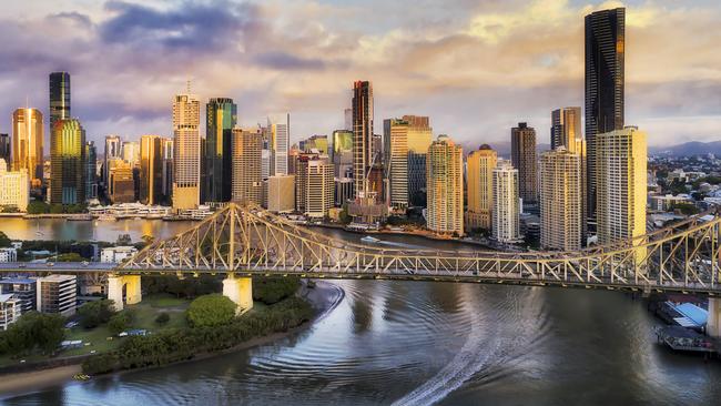 CLose to Story bridge across Brisbane river in front of Brisbane city CBD high-rise business and apartment towers with fast ferry on the water under the bridge.Escape 11 May 2025Doc updatePhoto - iStock
