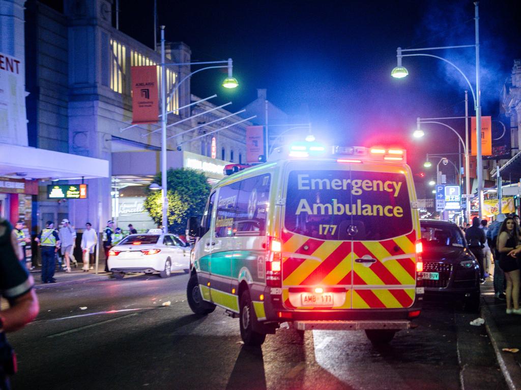 Paramedics attend to people needing help in Hindley St just after midnight, New Year’s Day, 2020. Picture: AAP / Morgan Sette