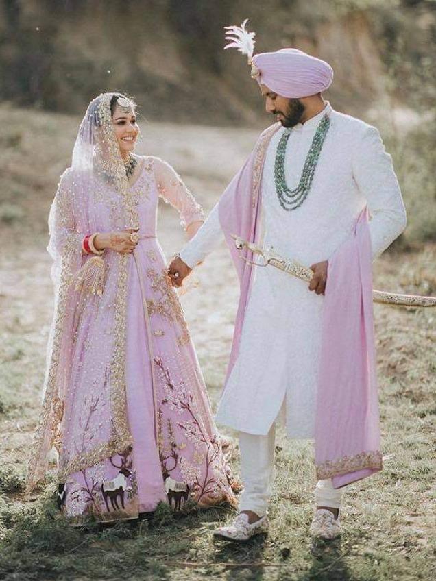 Pearl and Rupinder in traditional Indian dress at their wedding