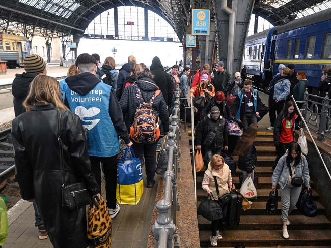 Evacuees from Zaporizhzhia region walk on a platform after arriving by an evacuation train at the railway station of the western Ukrainian city of Lviv. Picture: AFP