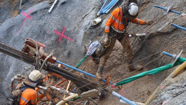 Workers repairing Beechmont Rd.