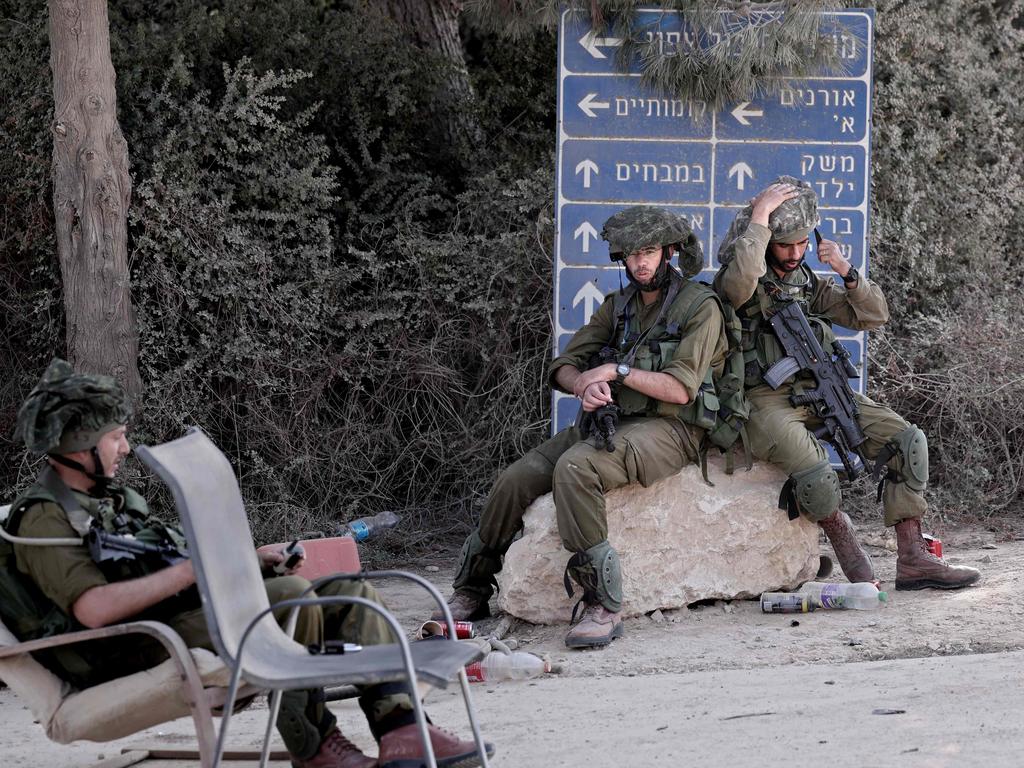 Israeli soldiers guard Kibbutz Be’eri along the border with the Gaza Strip. Picture: AFP