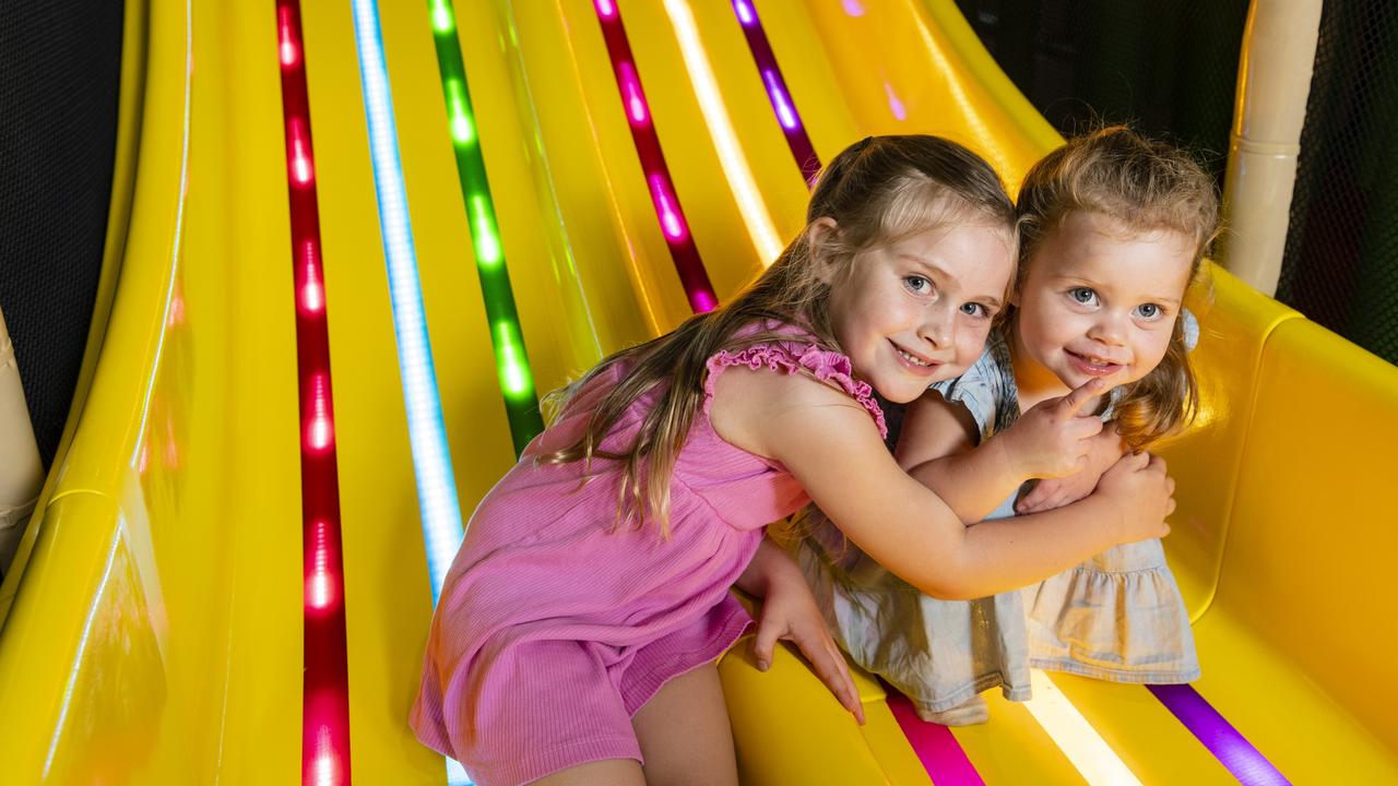 Ivy and little sister Remi Ferguson on the slide as Tabatinga at City Golf Club. Picture: Kevin Farmer