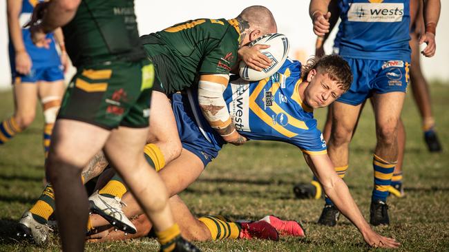 City’s Jack Leigh is tackled by Mittagong’s Kieran Rankmore. Pics by Julian Andrews.