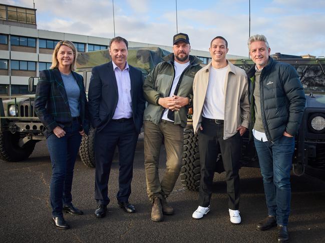 VicScreen CEO Caroline Pitcher, MP Colin Brooks, director and co-writer Patrick Hughes, actor Blake Richardson and producer Greg McLean on the set of War Machine in Laverton. Picture: Ben King.