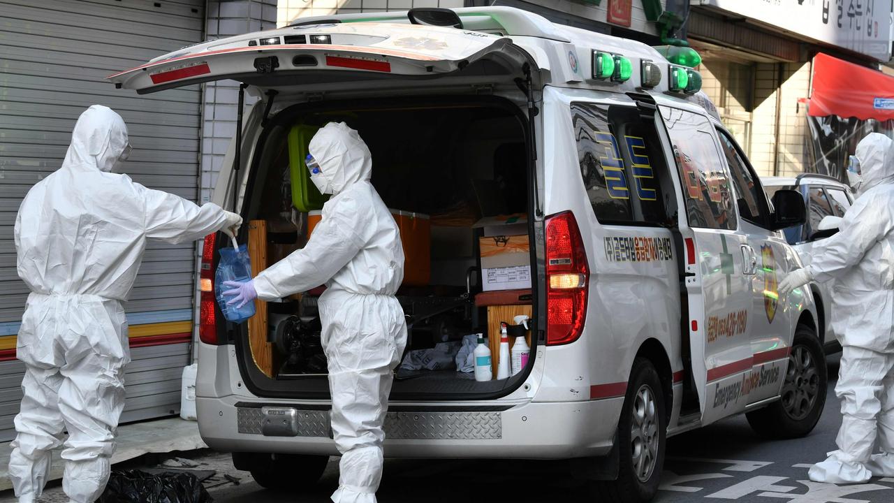 South Korean medical workers visit suspected infected residence near Daegu branch of the Shincheonji church. Picture: Jung Yeon-je