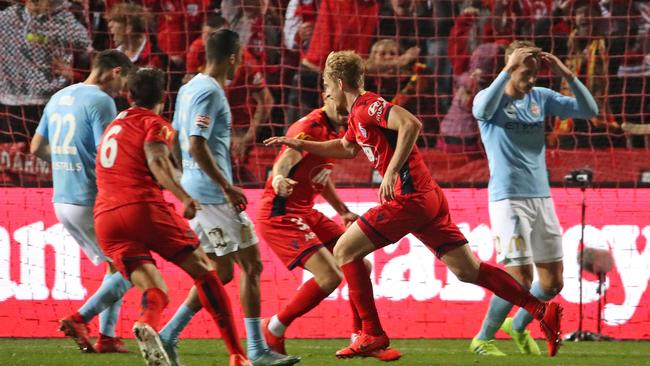 Melbourne City players are dejected after Adelaide United’s Ben Halloran scored the matchwinning goal. Picture: Getty Images