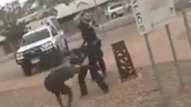 A screenshot from the video, in which a female police officer is allegedly pulled to the ground by her hair by a teen girl. Picture: Supplied