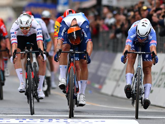 Aussie Michael Matthews (centre) is pipped at the line by Jasper Philipsen (right) at the 115th Milan-San Remo in March. Tour favourite Tadej Pogacar finished third. Matthews is in good form and could snag stages in this year’s Tour. Picture: Getty