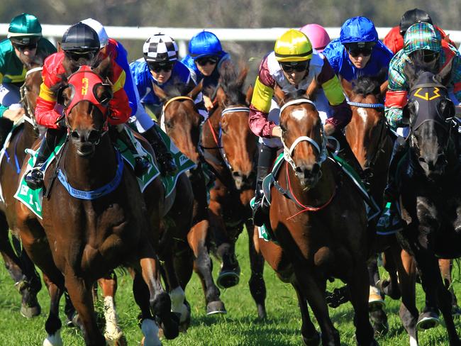 Loving home ridden by Tye Angland  (yellow cap, maroon with yellow armbands) wins race 1 during Scone  Races located in the Upper Hunter Region of NSW. The Bend . Pic Jenny Evans