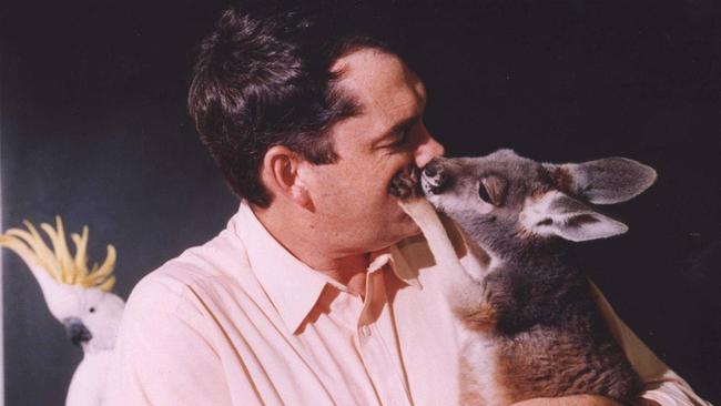 Conservation biologist and UNSW professor Michael Archer with his pet wallaby. He advocates for keeping native animals as pets for conservation and education.