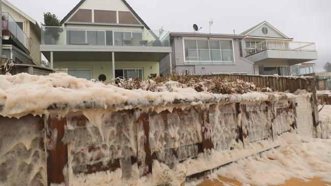 The same strip of houses between Stuart and Ramsay streets were again impacted by the weekend storms which whipped up seafoam on Sunday and Monday. Picture: John Grainger