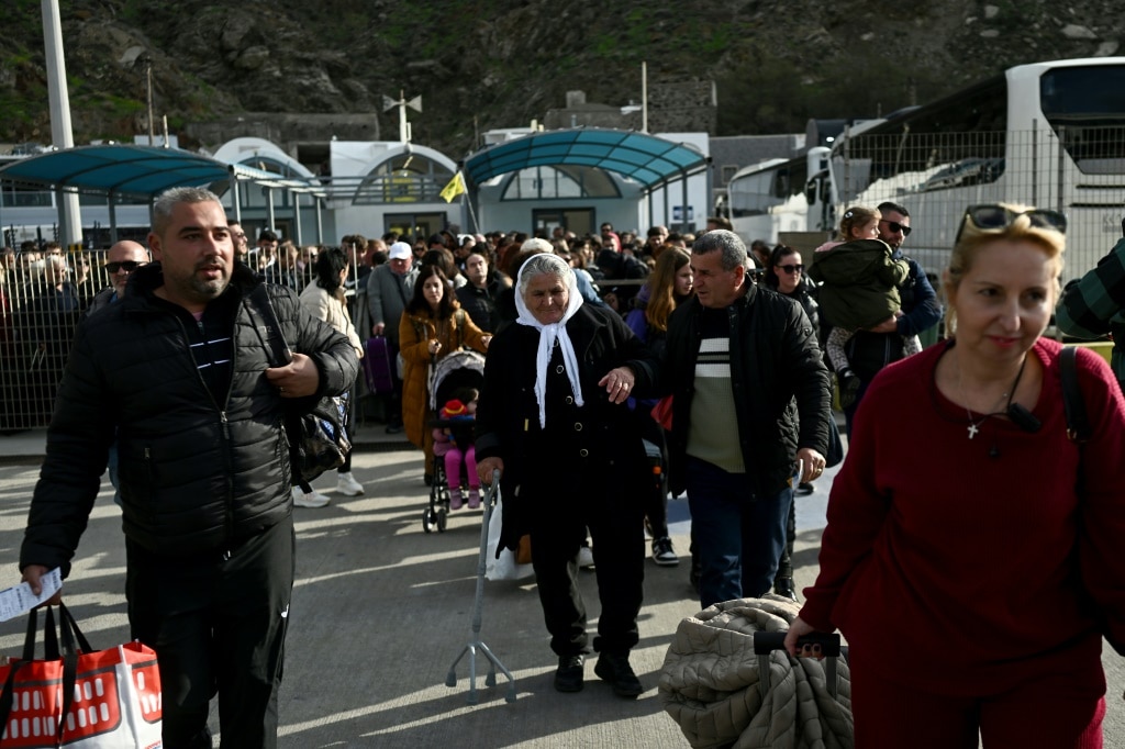 Crowds embarking a ferry to leave Santorini on Monday