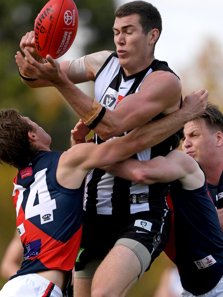 VFL: Collingwood’&#149;s Mason Cox is set upon by Coburg defenders. Picture: Andy Brownbill