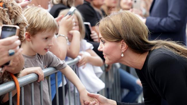 WINDSOR, ENGLAND - SEPTEMBER 10: Catherine, Princess of Wales meets members of the public on the long Walk at Windsor Castle arrive to view flowers and tributes to HM Queen Elizabeth on September 10, 2022 in Windsor, England. Crowds have gathered and tributes left at the gates of Windsor Castle to Queen Elizabeth II, who died at Balmoral Castle on 8 September, 2022. (Photo by Chris Jackson/Getty Images)