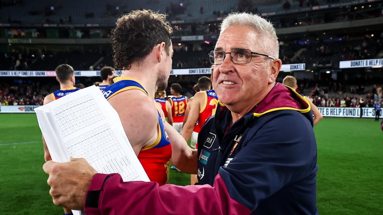 MELBOURNE, AUSTRALIA - JUNE 23: Chris Fagan, Senior Coach of the Lions hugs Lachie Neale of the Lions during the 2023 AFL Round 15 match between the St Kilda Saints and the Brisbane Lions at Marvel Stadium on June 23, 2023 in Melbourne, Australia. (Photo by Dylan Burns/AFL Photos via Getty Images)