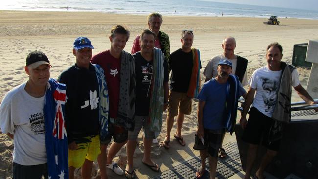 The ‘Just Living the Dream’ lads (from left) Paul Hastings, Phil Trimble, Andrew McGown, Mark Canning, Chris Burton, Craig Hassell, Vince Hutton (front) Barry Mallet and Dallas Connelley at the beach for their daily 5.30am dip at Surfers Paradise