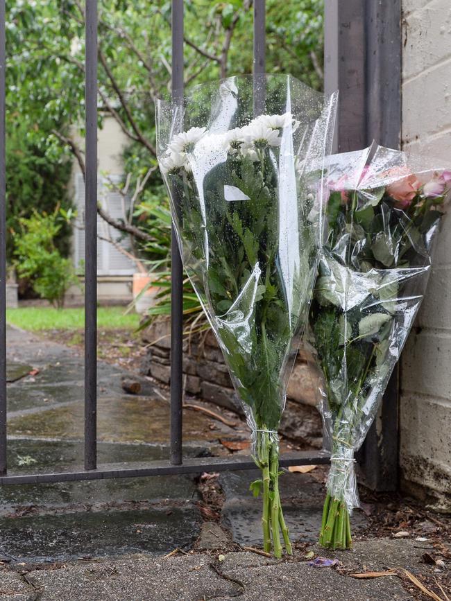 Flowers at the front gate of Dr Yung’s home in Gilberton. Picture: NCA NewsWire / Brenton Edwards