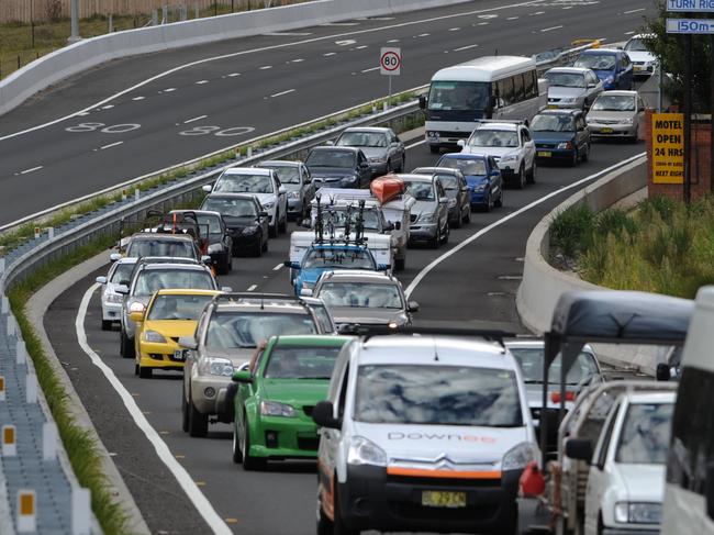 Easter holiday traffic crawls through the Blue Mountains west of Sydney as holiday makers return home. Pictured are cars heading east along The Great Western Highway just past Wentworth Falls.