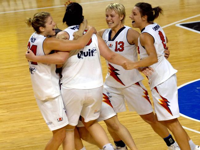 Adelaide Lightning players celebrate their WNBL championship grand final win in 2008.