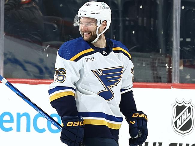 PHILADELPHIA, PENNSYLVANIA - MARCH 04: Nathan Walker #26 of the St. Louis Blues (L) reacts after defeating the Philadelphia Flyers at the Wells Fargo Center on March 04, 2024 in Philadelphia, Pennsylvania. (Photo by Tim Nwachukwu/Getty Images)