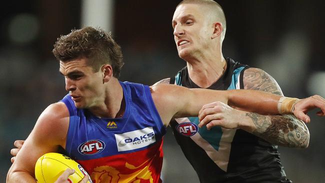 ADELAIDE, AUSTRALIA - JULY 14: Ben Keays of the Lions and Hamish Hartlett of the Power contest the ball during the round 16 AFL match between the Port Adelaide Power and the Brisbane Lions at Adelaide Oval on July 14, 2019 in Adelaide, Australia. (Photo by Daniel Pockett/Getty Images)