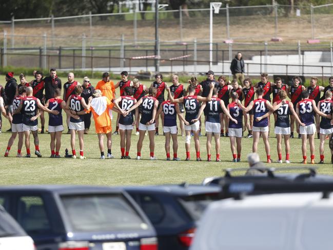 Players line-up before the game to honour the memory of the late Ben Tournier.