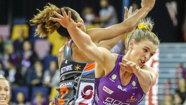 Serena Guthrie (left) of the Giants and Gabi Simpson of the Firebirds collide during the last seaosn of Super Netball.