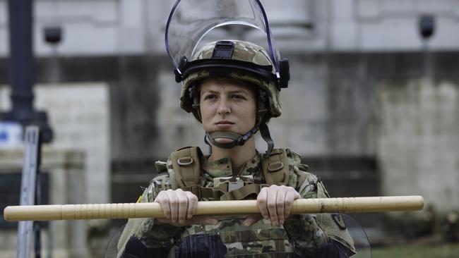 A member of the Army National Guard holds a riot shield and baton in Kenosha during Donald Trump’s visit. Picture: Angus Mordant.