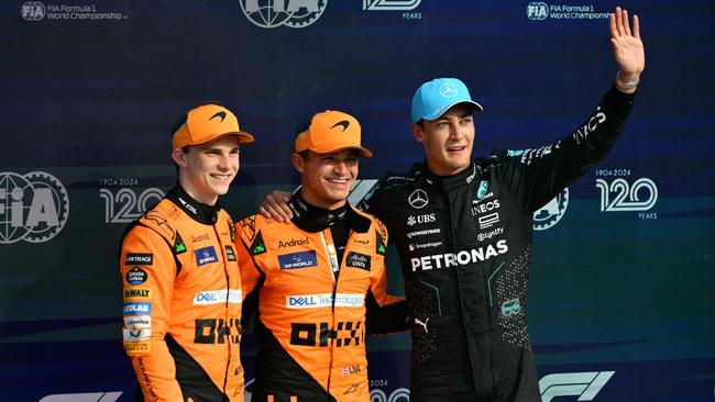 Oscar Piastri, Lando Norris and George Russell. (Photo by Andrej ISAKOVIC / AFP)