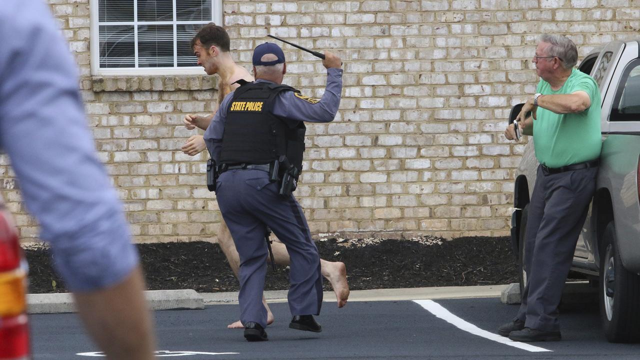 State Police chased Matthew Bernard with batons. Picture: Matt Bell/Danville Register and Bee via AP