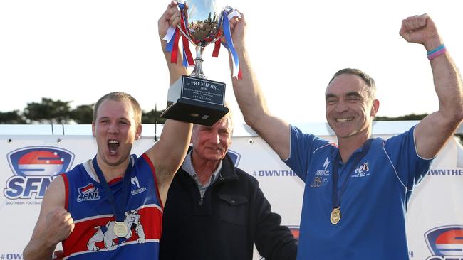 Jason Heffernan (right) lifts the 2018 SFNL Division 1 cup. Picture: Hamish Blair