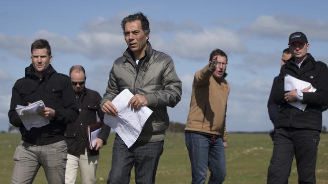 Mr Shahin (silver jacket) with Skaife (brown jacket) and the park planning team on a visit to the Tailem Bend site. Photo: Matt Turner, Sunday Mail.