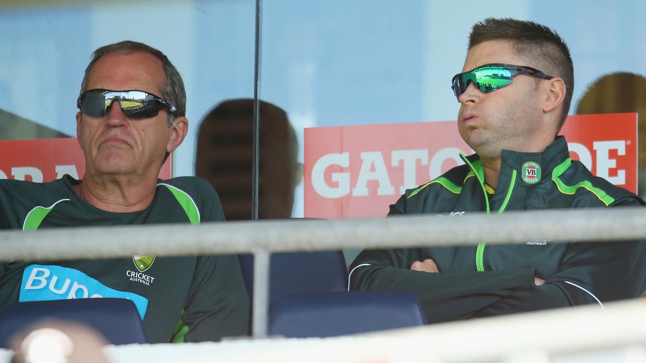 PERTH, AUSTRALIA - NOVEMBER 14: Michael Clarke of Australia looks on as he sits injured in the players viewing box with Peter Brukner (L), Australian Team Doctor during game one of the men's one day international series between Australia and South Africa at WACA on November 14, 2014 in Perth, Australia. (Photo by Scott Barbour/Getty Images)