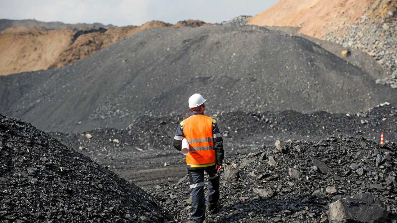 Coal mining in an open pit - Worker is looking on the huge open pit. Picture: agnormark