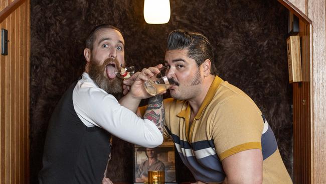 Co-founders of Double Deuce Lounge, Sebastian “Cosmo” Soto and Charlie Lehmann pictured with their famous cocktail, The Full Bush. Picture: Daily Telegraph/ Monique Harmer