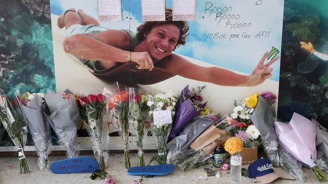 Flowers, hand written notes and other items left by the friends of murder victim Jack Beasley at the scene of the tragedy outside the Surfers Paradise IGA. Photographer: Liam Kidston.