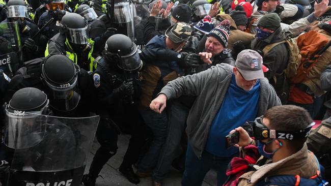 Riot police battle with rioters at the Capitol. Picture: AFP.