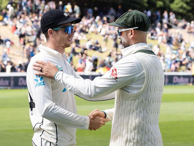 Nathan Lyon shares a word with New Zealand spinner Mitchell Santner, who was overlooked for the first Test. Picture: Marty Melville/AFP