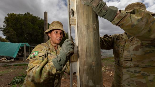 Trooper Alexis Matthews places poles at a Parndnana School. Picture: ADF