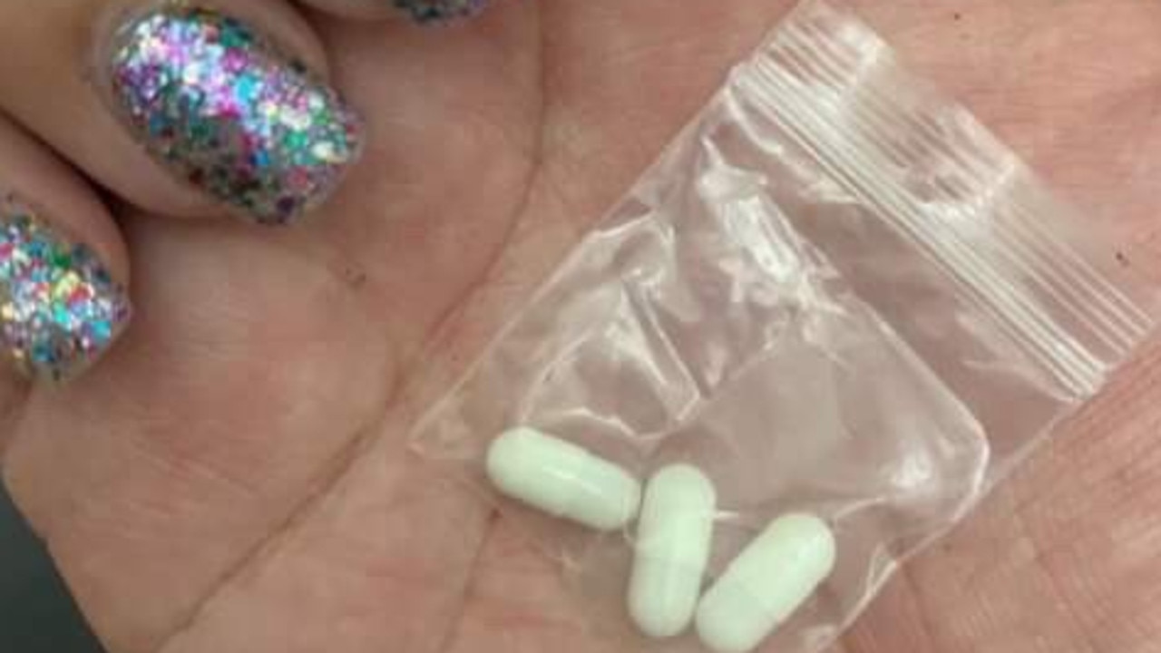 A punter at the Field Day festival on January 1 shows what appears to be drugs. Picture: Derrick Krusche