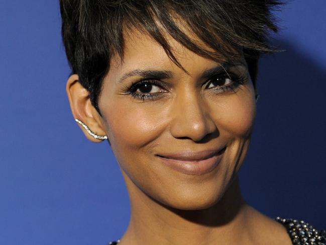 FILE - This June 16, 2014 file photo shows Halle Berry at the premiere of the series, "Extant," in Los Angeles. Berry plays an astronaut who returns home from a yearlong solo mission only to discover that, while in flight, she was somehow impregnated. The series premieres Wednesday, July 9, at 9 p.m. ET. (Photo by Chris Pizzello/Invision/AP, File)