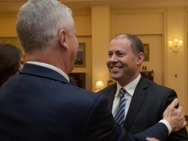 Josh Frydenberg is congratulated after being sworn in as Treasurer by Governor-General Sir Peter Cosgrove at Government House yesterday. Picture: Getty Images