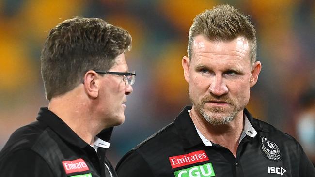 Magpies head coach Nathan Buckley talks to his assistant Robert Harvey, who is potentially in the mix for the top job at North.