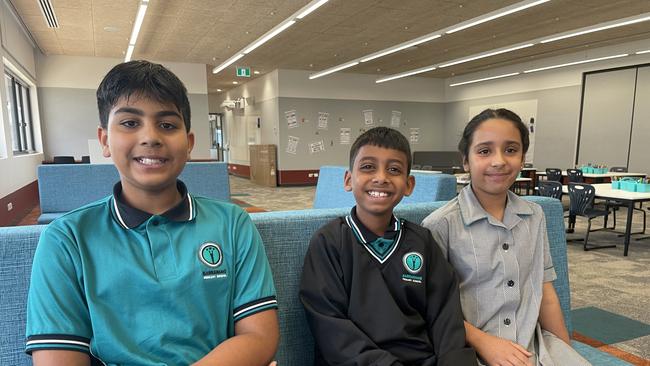 Students Kirtvir, 11, Daham, 8, and Anaheet, 10, were excited to see the new library on their first day. (Picture: Olivia Condous)