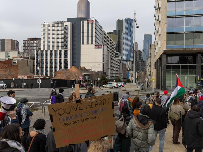 The group marches along Swanston St. Picture: Jason Edwards