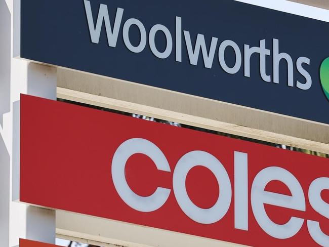 coles and woolies signs together