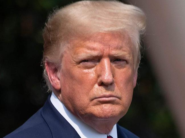 US President Donald Trump looks on before delivering remarks on Rolling Back Regulations to Help All Americans on the South Lawn at the White House on July 16, 2020 in Washington,DC. (Photo by JIM WATSON / AFP)